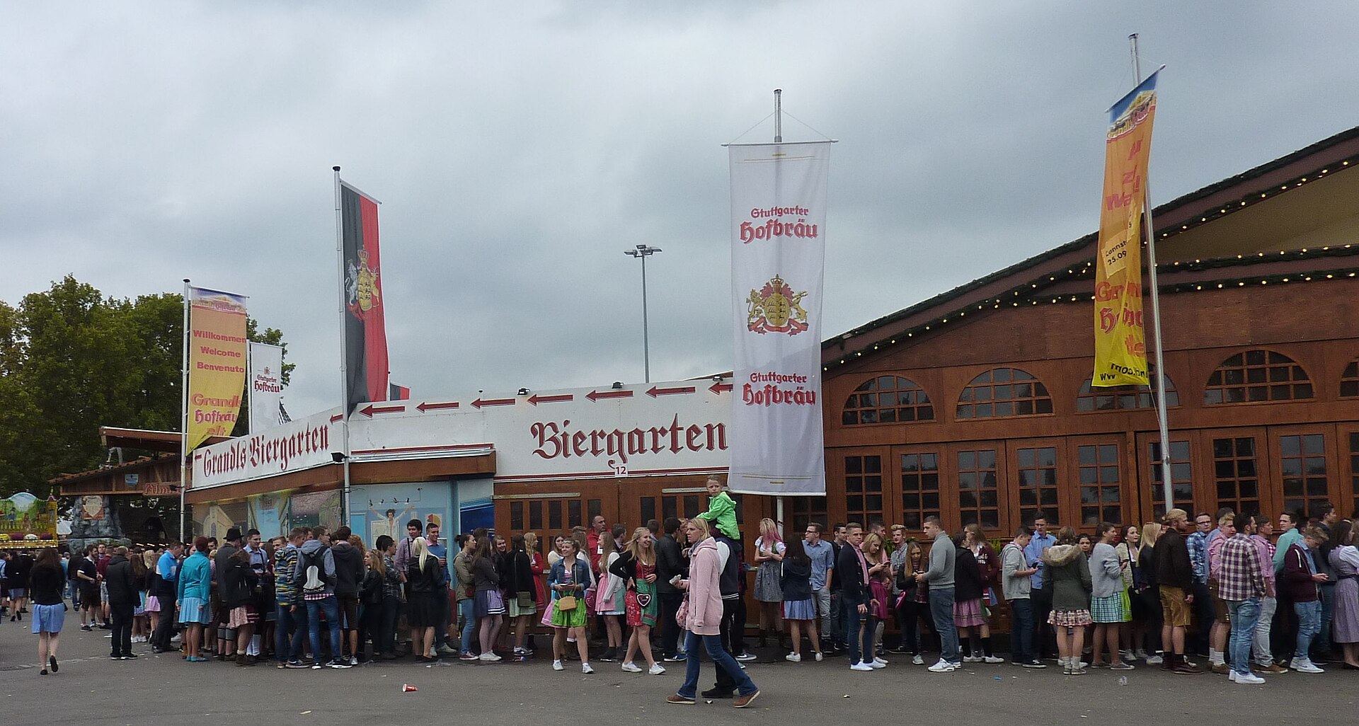 Visitors queue outside Cannstatter Volksfest in 2015