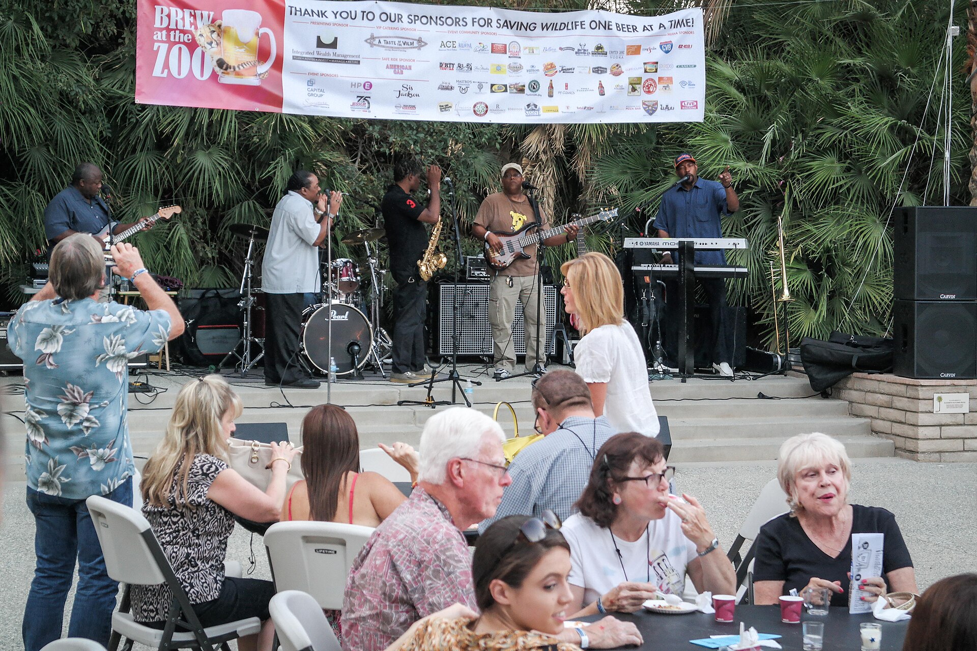 Guests enjoying live music at a Brew at the Zoo event