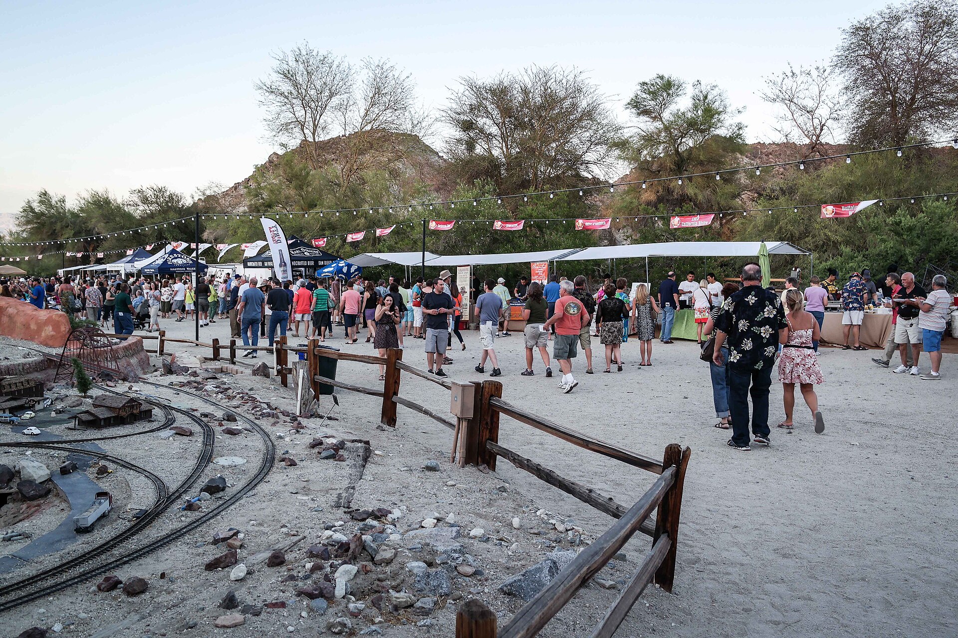 Visitors gathering outdoors at a Brew at the Zoo event