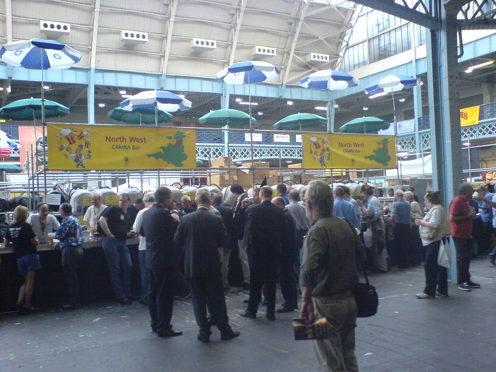 Festival guests gathered at a British beer festival bar