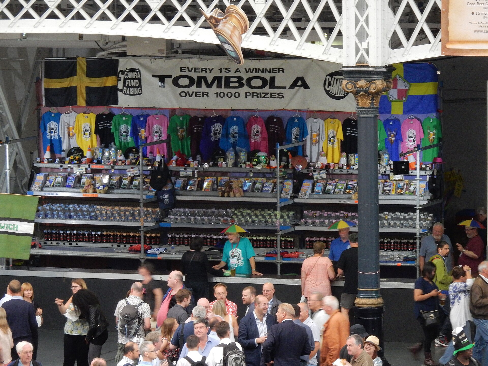 A lively crowd exploring stands at a British beer festival